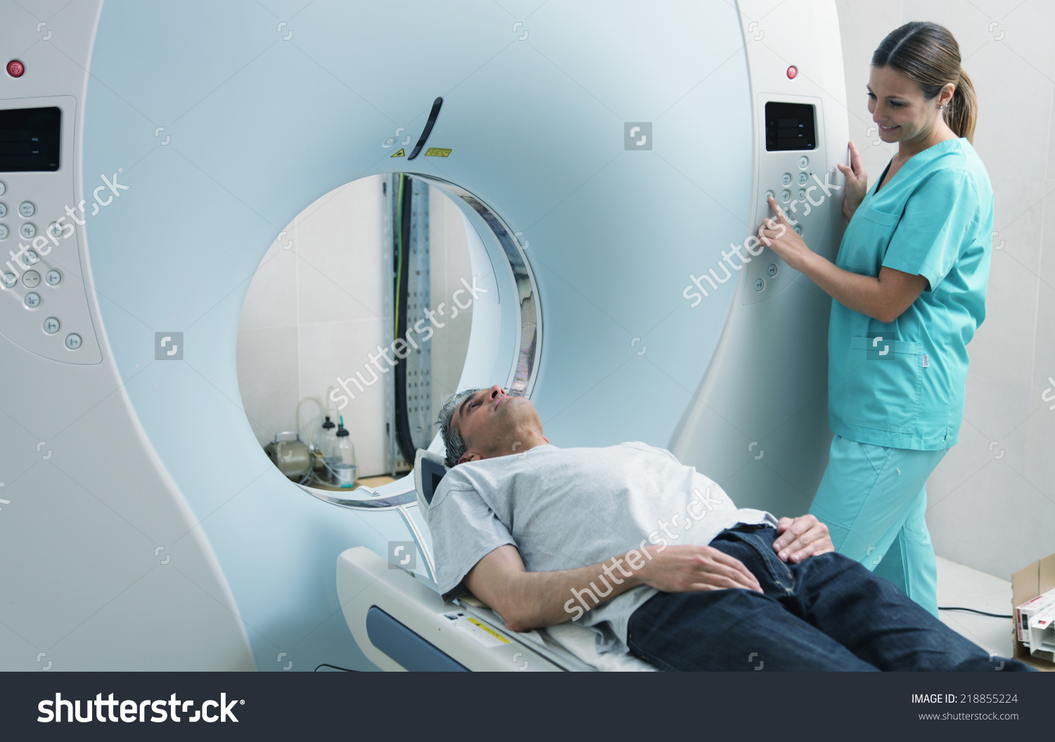 stock-photo-young-female-doctor-examining-man-in-s-with-ct ...